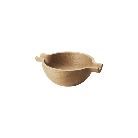 A light natural wood bowl with two small side handles, shown on a plain white background.