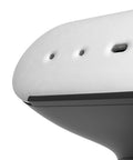 Close-up of a white electronic device with black accents on a white background