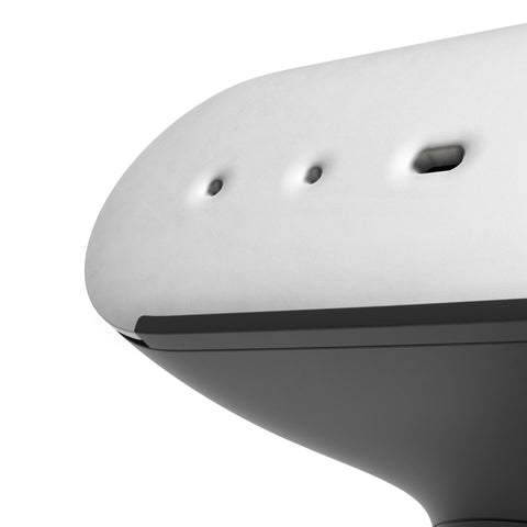 Close-up of a white electronic device with black accents on a white background