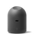 Black cylindrical device on a white background