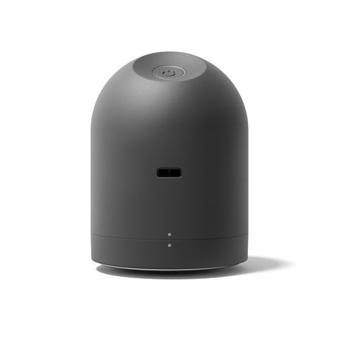Black cylindrical device on a white background
